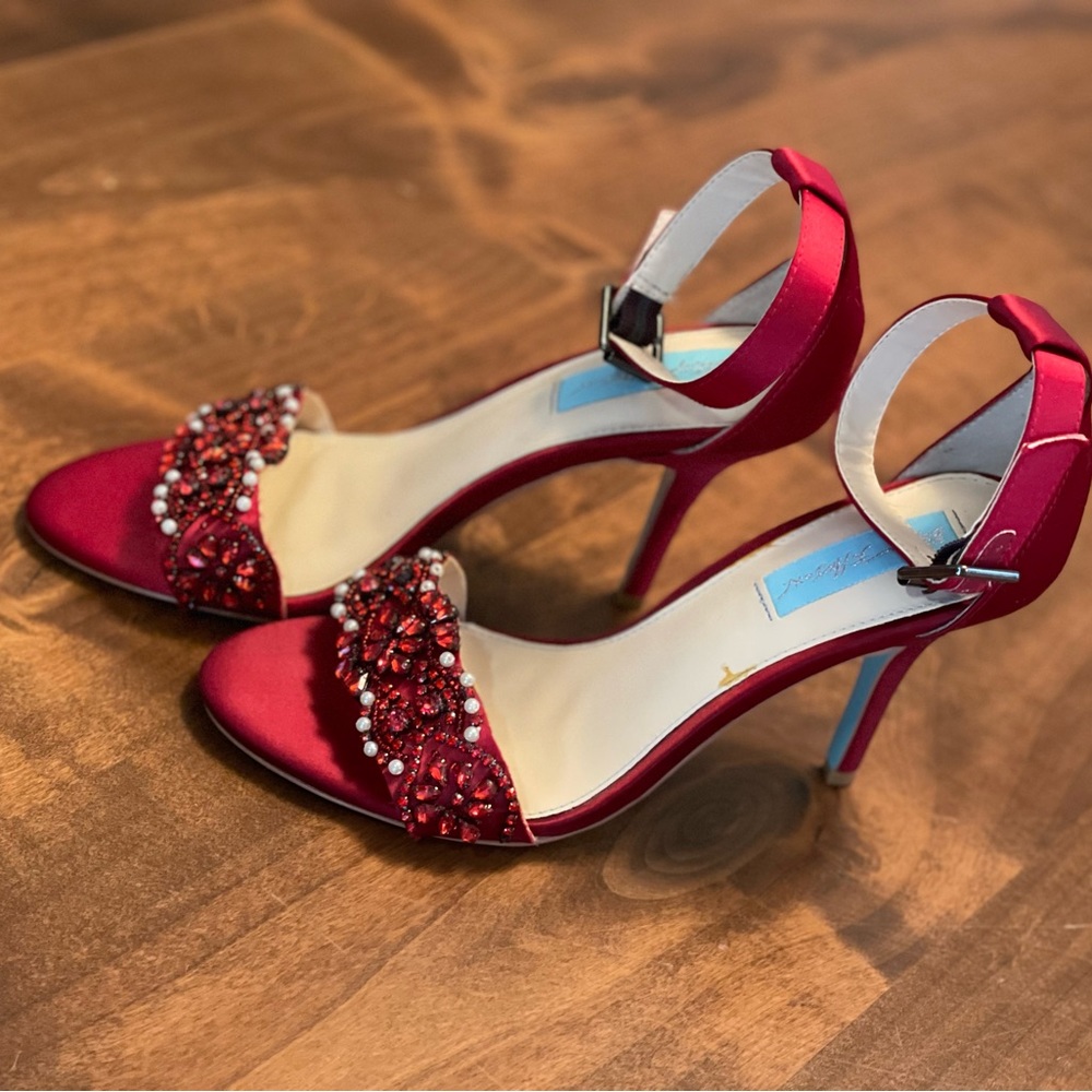 Red Betsey Johnson strap heels. Size 7. Good used condition.